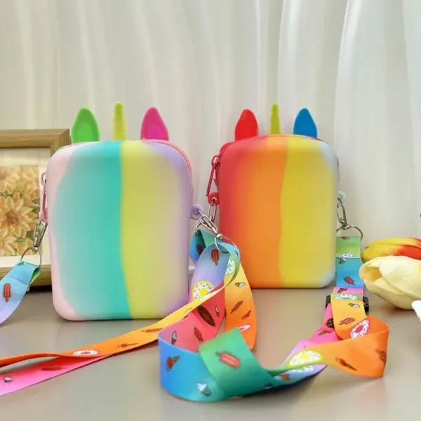 Two rainbow unicorn purses with straps