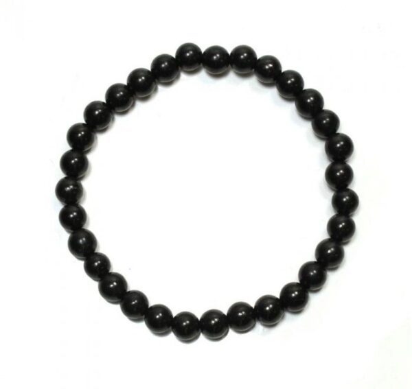 Black beaded bracelet on white background.