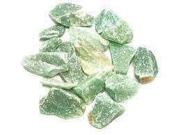 Green aventurine crystal chips on white background.