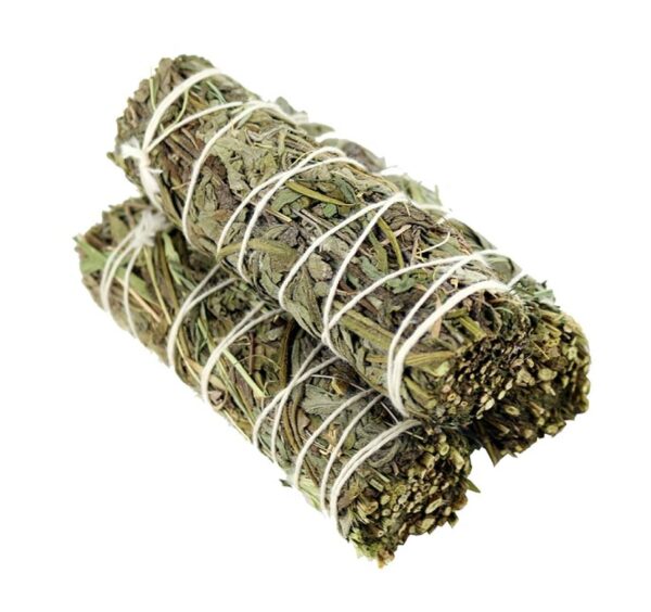 Two bundles of green herbal smudge sticks.