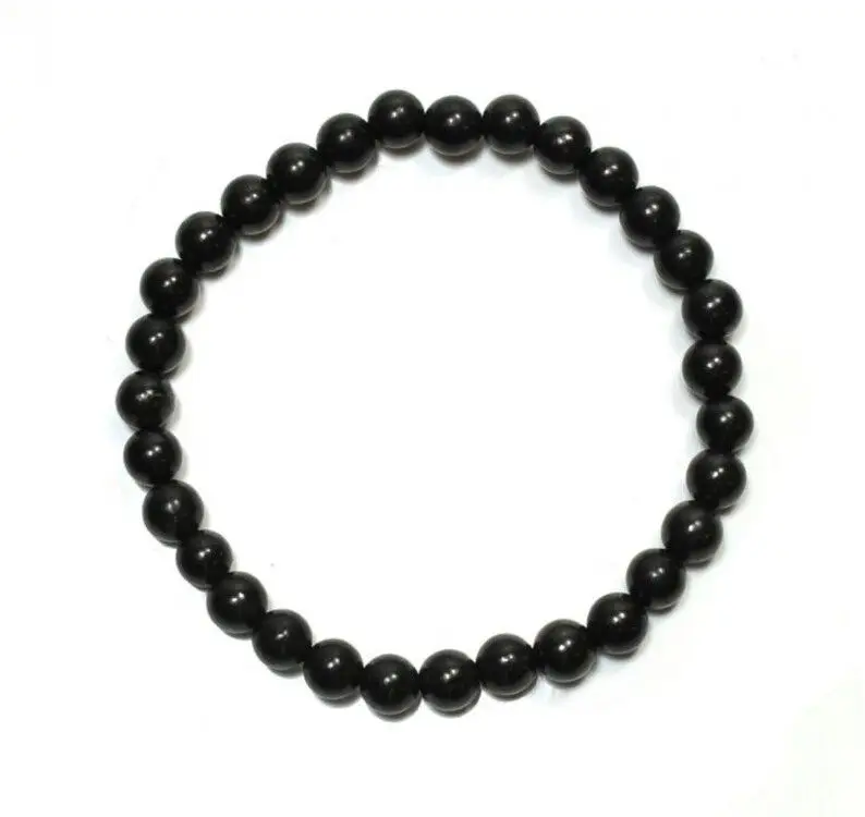 Black beaded bracelet on white background.