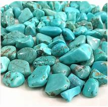 A collection of turquoise gemstone pebbles.