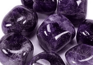 A collection of smooth purple amethyst stones.