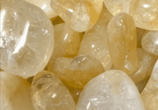 Close-up of tumbled citrine stones.