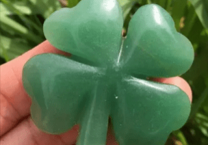 Green jade four-leaf clover charm.