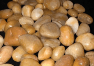 A pile of smooth, tan pebbles.