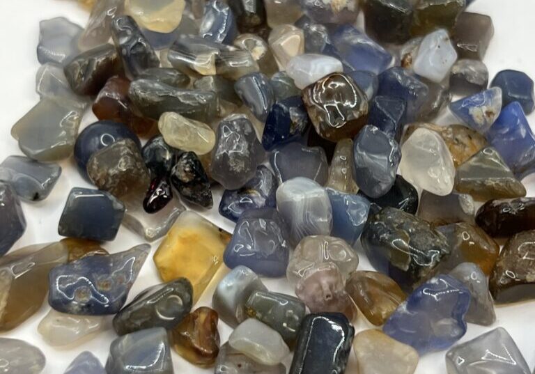 Assortment of blue, brown, and white gemstones.