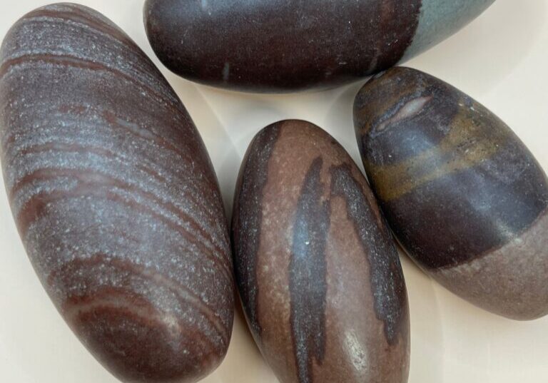 Four brown and gray striped stones.