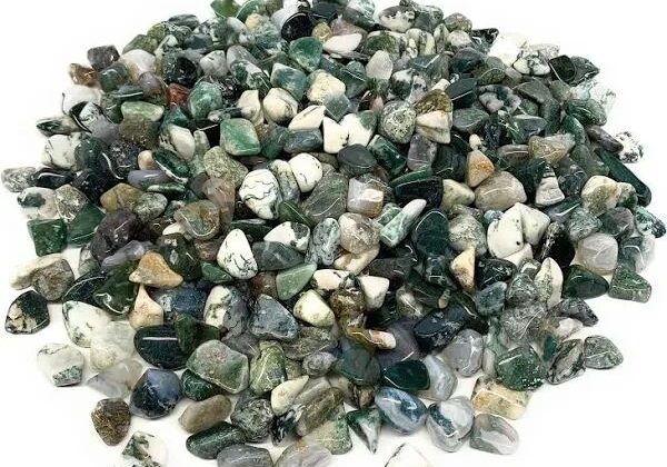 Green moss agate tumbled stones pile.