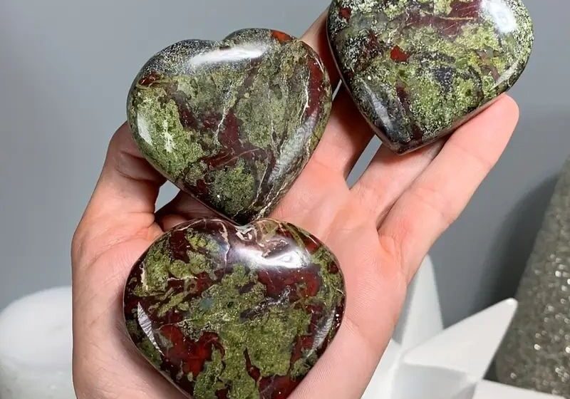 Three green and red heart-shaped stones.