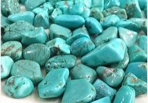 A collection of turquoise gemstone pebbles.